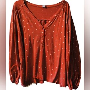 Orange top with white dots